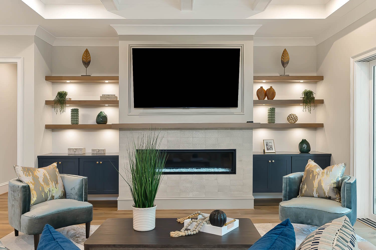 Cozy living room with built-in shelves and fireplace, styled and photographed by Raleigh real estate photographer R. Huggins
