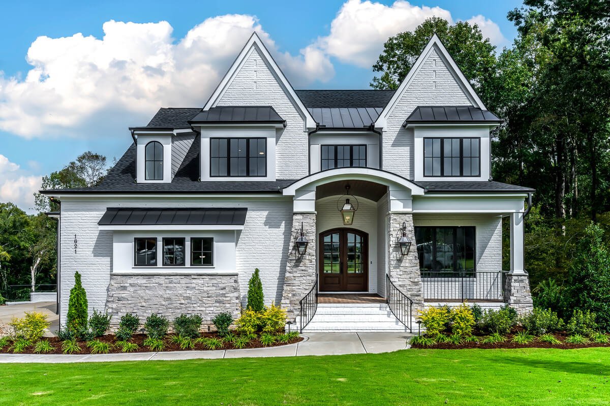 Front exterior of a newly built modern home in Raleigh, professionally photographed by real estate photographer R. Huggins