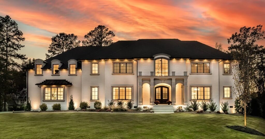 Luxury estate with custom lighting captured at sunset, professionally photographed in Raleigh by real estate photographer R. Huggins